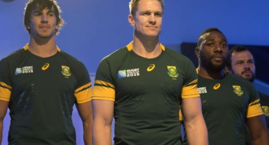 From L South African Springboks' Eben Etzebeth, Jean de Villiers and Tendai Mtawarira pose for a photo during the unveiling of the team's new jersey, in Cape Town, on June 4, 2015.  By Rodger Bosch AFPFile