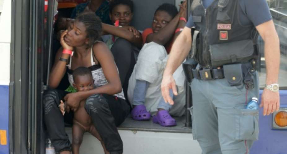 Rescued migrants on the Italian Coast Guard patrol vessel Dattilo on July 11, 2015, at Palermo harbour.  By Marcello Paternostro AFP