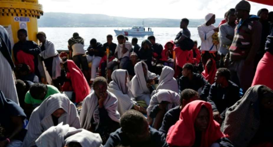 Migrants arrive in Vibo Marina, after a rescue operation in the Mediterranean Sea during which nine people drowned, ten were missing and nearly 1000 were rescued.  By Yara Nardi Italian Red CrossAFPFile
