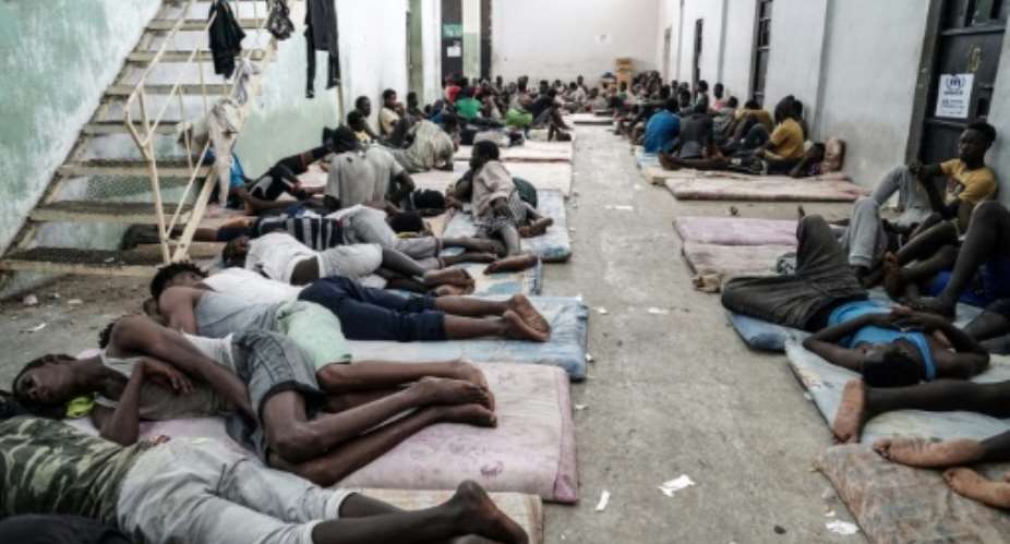 Migrants at a detention centre in Zawiyah, 45 kilometres west of Tripoli, on June 17, 2017.  By Taha JAWASHI AFP