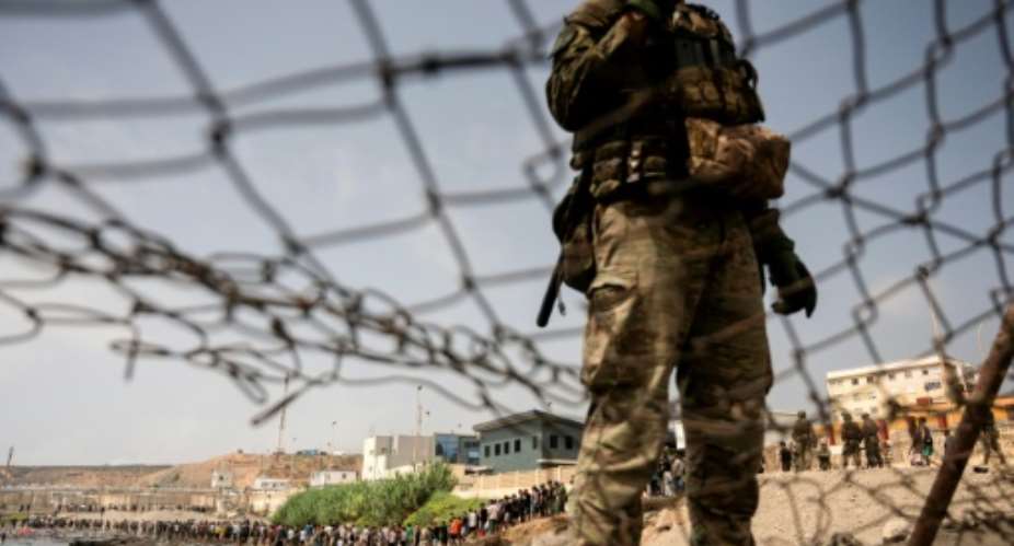 Migrants cross back to Morocco after they crossed the border to enter Spains north Africas Ceuta enclave on July 31, 2026.  By JORGE GUERRERO (AFP)
