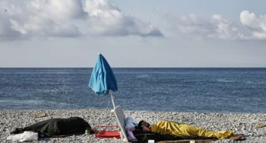 Migrants sleep on the beach in Ventimiglia, near the French border, trying to cross. Since the start of 2017, over 117,000 have crossed the Mediterranean to Europe from north Africa -- more than 96,000 of them arriving in Italy.  By Marco BERTORELLO AFPFile