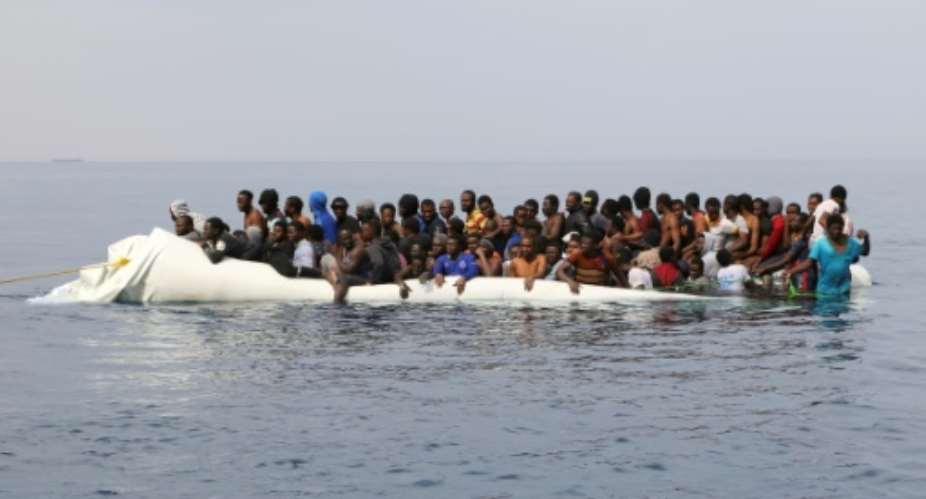 Migrants waiting to be rescued off the Libyan coast.  By Abdullah ELGAMOUDI AFPFile