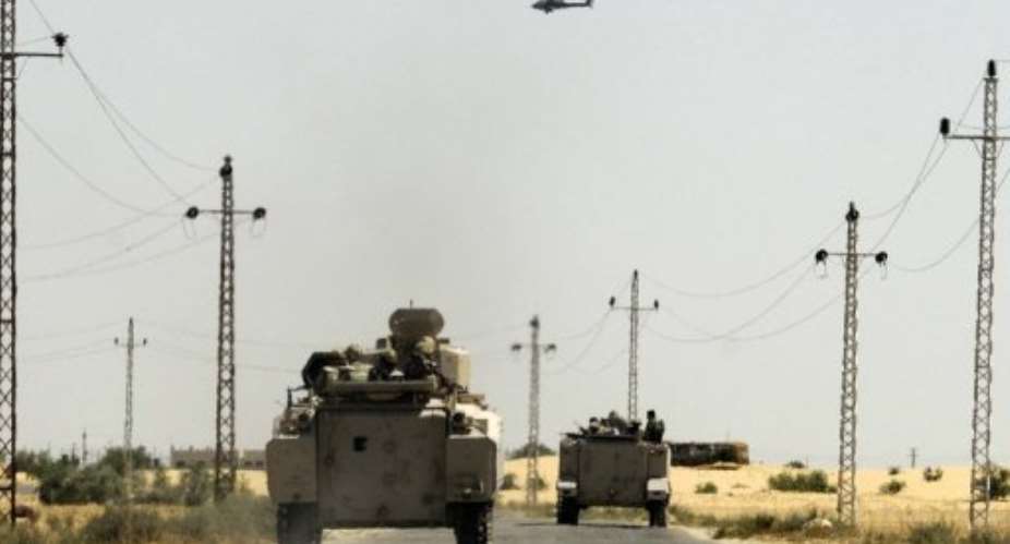 Egyptian soldiers and a military helicopter are seen in the area near the Rafah border crossing, on May 21, 2013.  By  AFPFile