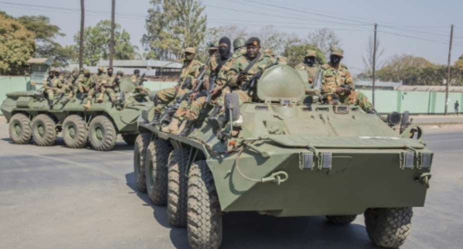 Military: Armoured personnel carriers on the streets of Lusaka on Tuesday.  By SALIM DAWOOD AFP