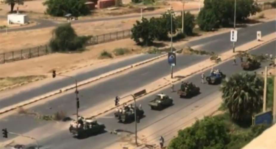 Military vehicles in the Sudanese capital Khartoum, shown in an image grab taken from a video by an anonymous source.  By - AnonymousESNAFP