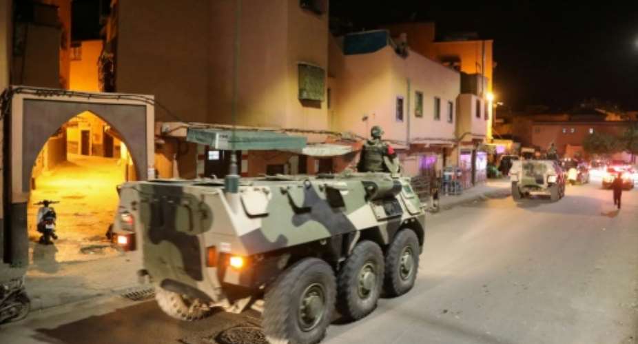 Military vehicles patrol the streets in the Moroccan city of Marrakesh to help enforce the government's order for people to stay at home amid the coronavirus COVID-19 pandemic.  By - AFP