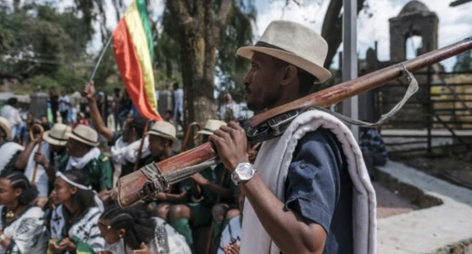 Militiaman Tesfahun Mande strolled through the streets of Gondar yelling chants in praise of Amhara fighters who took on the TPLF.  By EDUARDO SOTERAS AFP