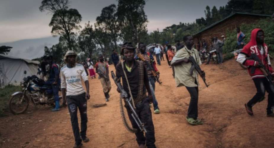 Militiamen from the CODECOURDPC group, pictured in the village of Wadda in Ituri province last September.  By ALEXIS HUGUET AFPFile