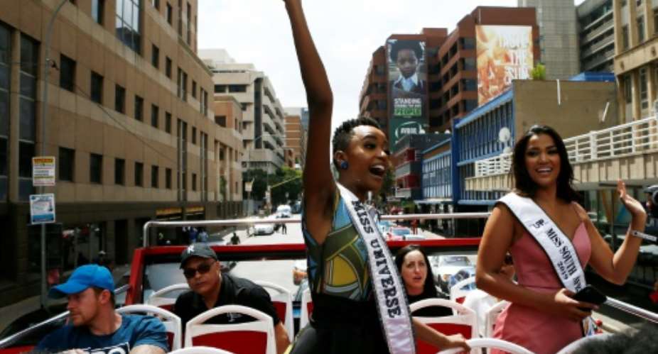 Miss Universe, Zozibini Tunzi L waved to crowds who came out to greet her and celebrate her victory.  By Phill Magakoe AFP