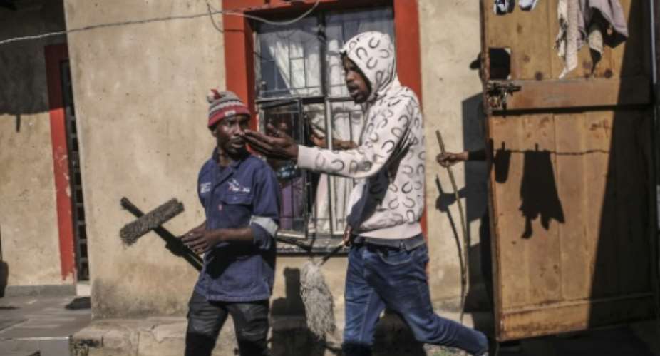 Mobs have gone door-to-door to demand that foreign nationals leave South Africa.  By MZINGENKOSI SIBANDA (AFP)