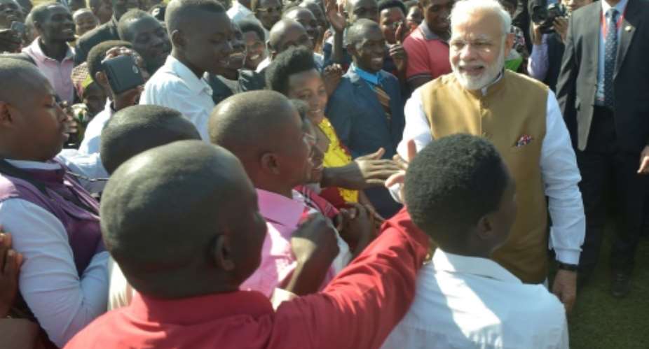 Modi donated 200 cows -- considered sacred in India -- to residents of a model village.  By SIMON MAINA AFP
