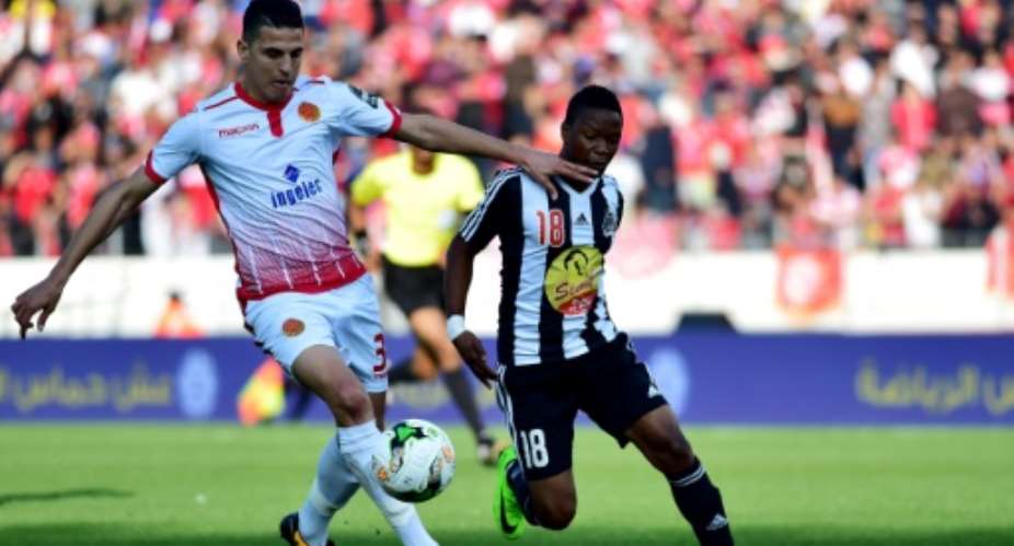 Mohamed Nahiri L of Moroccan club Wydad Casablanca and Rainford Kalaba of Democratic Republic of Congo side TP Mazembe will both hope their teams secure CAF Champions League quarter-finals places this weekend.  By STRINGER AFPFile