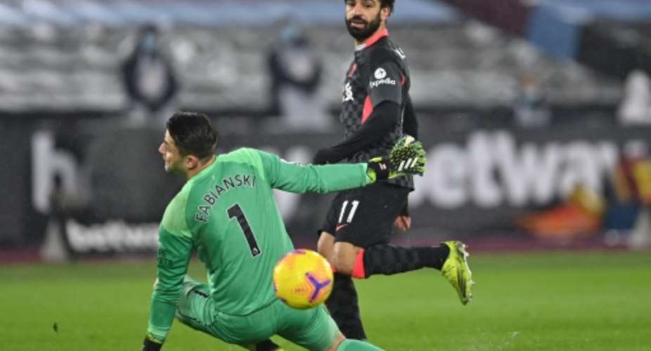 Mohamed Salah (R) scores his second goal for Liverpool against West Ham.  By Justin Setterfield (POOL/AFP)