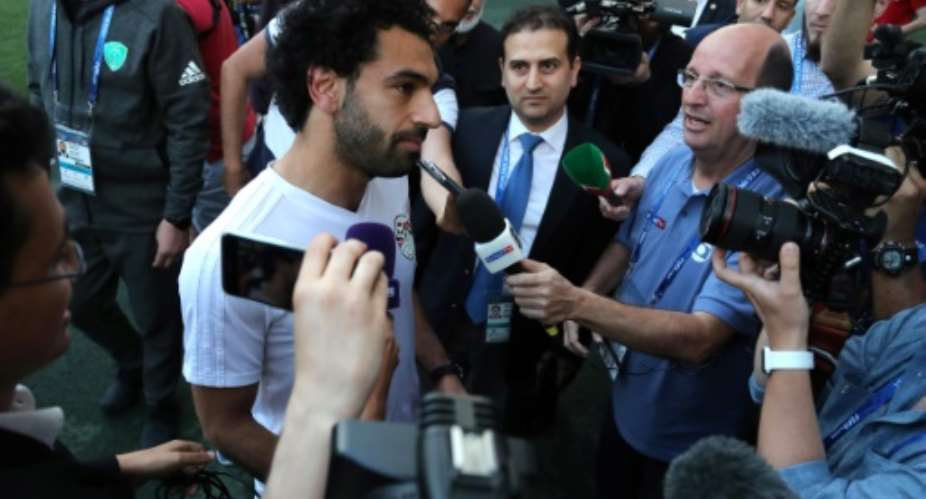 Mohamed Salah talks to journalists during a training of Egyptian team at the Akhmat Arena stadium in Grozny.  By KARIM JAAFAR AFP