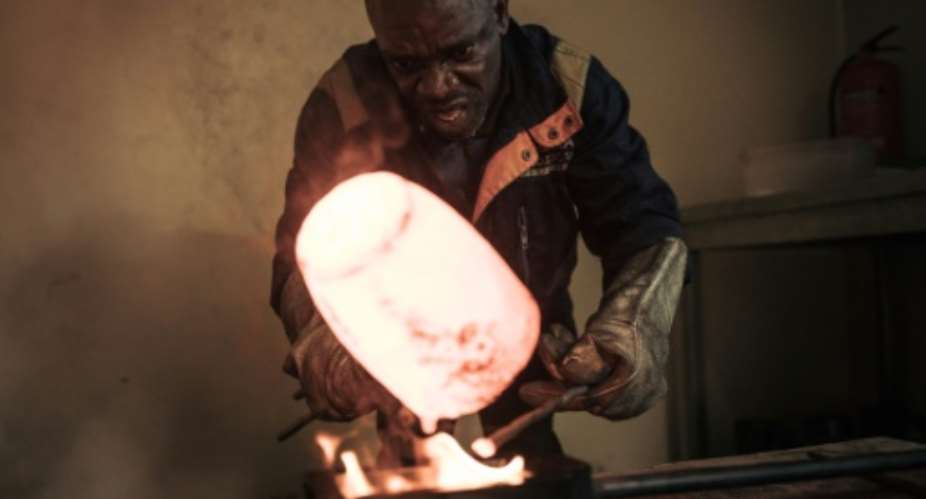 Molten treasure: A new joint venture between DRC and the UAE seeks to bring transparency to Congos notoriously murky gold mining sector.  By ALEXIS HUGUET (AFP)