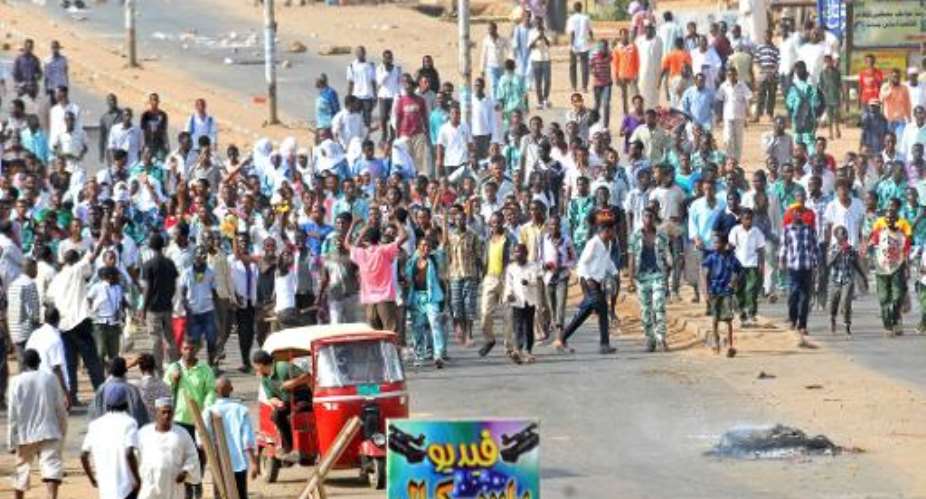Sudanese protestors demonstrate in Khartoum's twin city of Omdurman after the government announced steep price rises for petroleum products, on September 25, 2013.  By  AFPFile