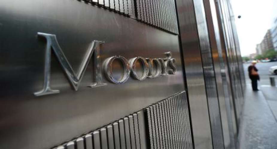 A sign for Moody's rating agency on the front of company headquarters in New York, September 18, 2012.  By Emmanuel Dunand AFPFile