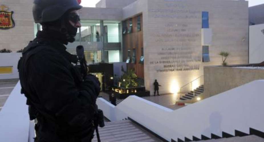 A member of the Moroccan special forces guard stands outside of the Central Bureau of Judicial Investigation BCIJ building on March 23, 2015 during a press conference by the governor of the BCIJ in Rabat.  By  AFPFile