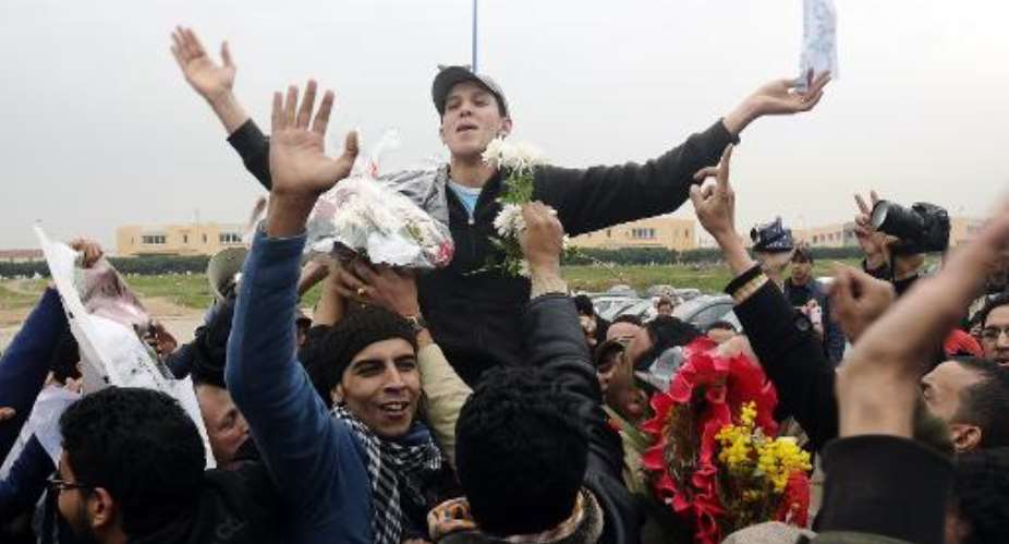 File picture taken on January 12, 2012, shows Mouad Belghawat C, a young Moroccan rapper known for his anti-monarchy lyrics, celebrating his release from the Oukacha prison in Casablanca.  By Chafik Arich AFPFile