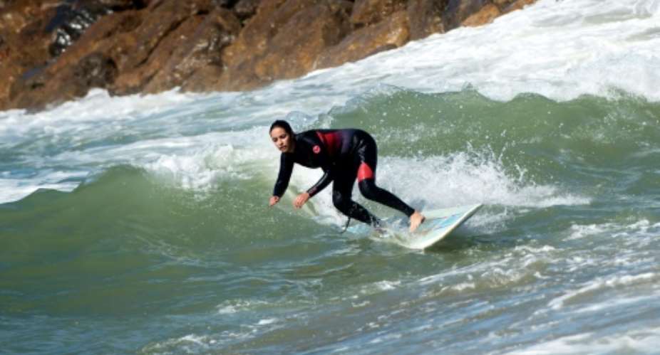 Moroccan women surfers have become increasingly common but some still face prejudice or harassment back on land.  By FADEL SENNA AFP