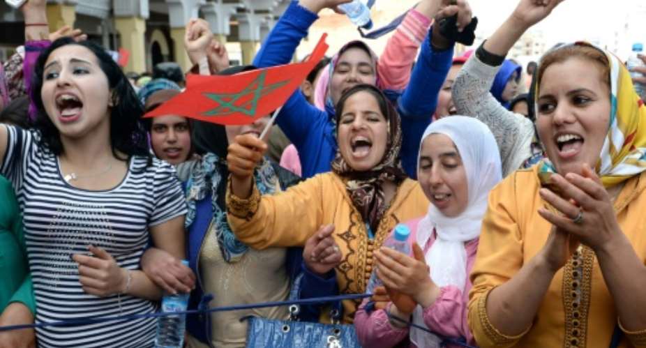 Moroccans shout slogans during a protest calling for gender equality as they mark International Women's Day in Rabat on March 8, 2015.  By FADEL SENNA AFPFile