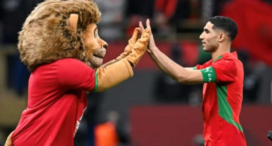 Morocco captain Achraf Hakimi celebrates after the Africa Cup of Nations hosts beat Nigeria on penalties in Wednesdays semi-final.  By Paul ELLIS (AFP)
