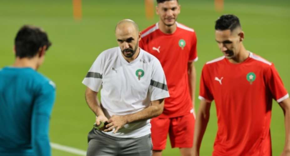 Morocco coach Walid Regragui oversees training at the World Cup.  By KARIM JAAFAR AFP
