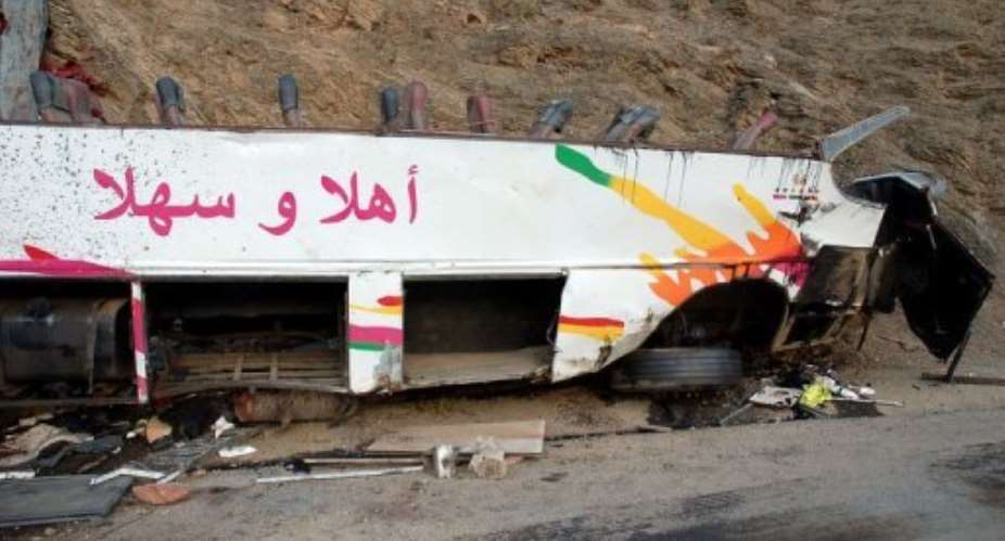 A picture shows a damaged bus after it plunged into a ravine in the Atlas mountains of southern Morocco.  By  (AFP)