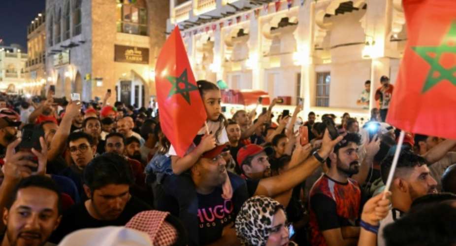 Morocco fans celebrate their last-16 win against Spain in the World Cup in Doha.  By ANDREJ ISAKOVIC AFP