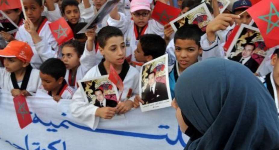 Under a new draft constitution the king would remain head of state, the military, and the Islamic faith.  By Abdelhak Senna (AFP)
