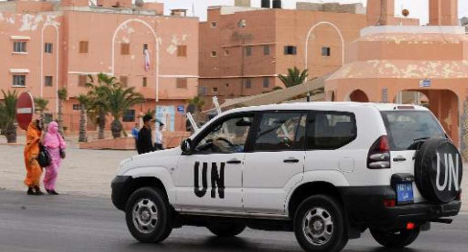 A United Nations car drives past the Mechouar square on May 14, 2013 in Laayoune, the capital of Moroccan-controlled Western Sahara.  By Fadel Senna AFPFile