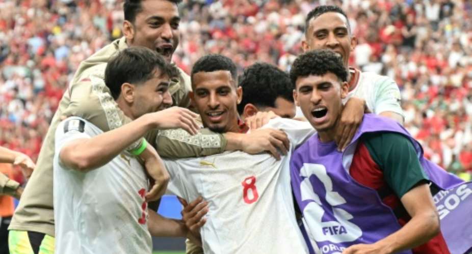 Morocco midfielder Azzedine Ounahi celebrates his second goal in a victory that sends the north Africans into the World Cup quarter-finals.  By RONALDO SCHEMIDT (AFP)