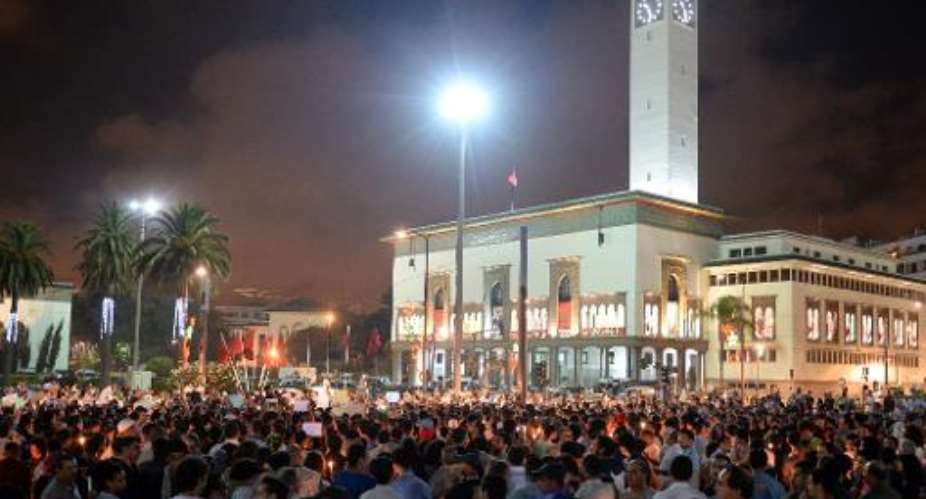 Protestors chant slogans during a demonstration on August 6, 2013 in Casablanca against the pardon by King Mohamed VI of Morocco to a Spanish paedophile.  By Fadel Senna AFPFile