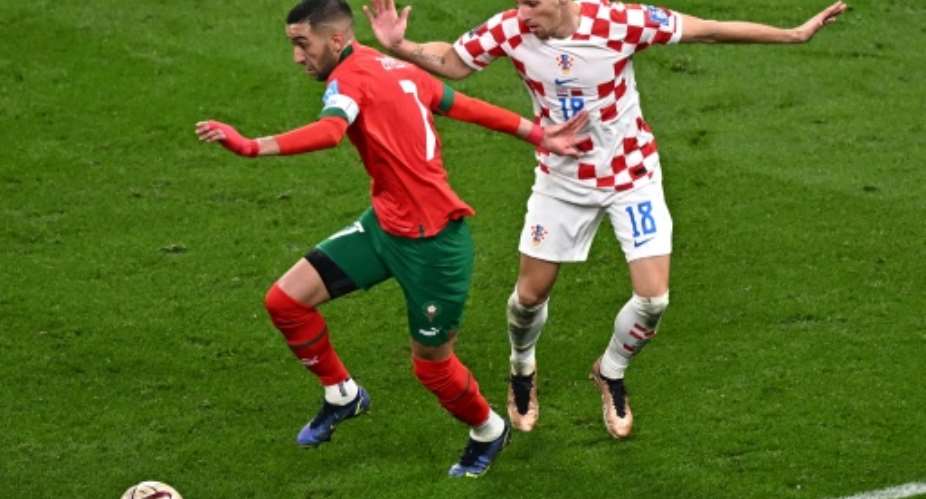 Morocco star Hakim Ziyech L playing against Croatia in the World Cup third-place playoff in Qatar on December 17, 2022..  By Anne-Christine POUJOULAT AFP
