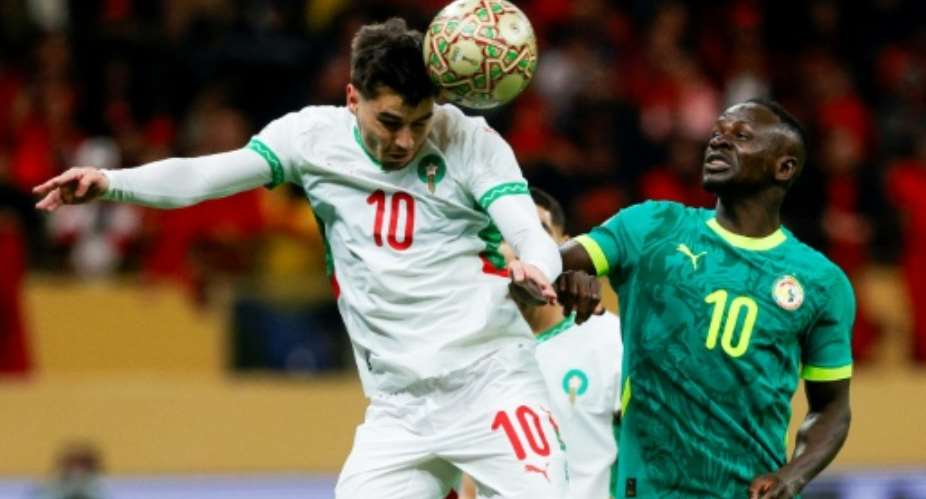 Morocco striker Brahim Diaz (L) heads the ball past Senegal captain Sadio Mane during the 2025 Africa Cup of Nations final in Rabat..  By Abdel Majid BZIOUAT (AFP)