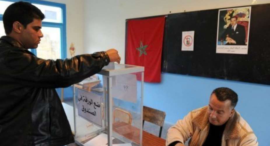 A man casts his ballot in the legislative election in Rabat.  By Abdelhak Senna AFP