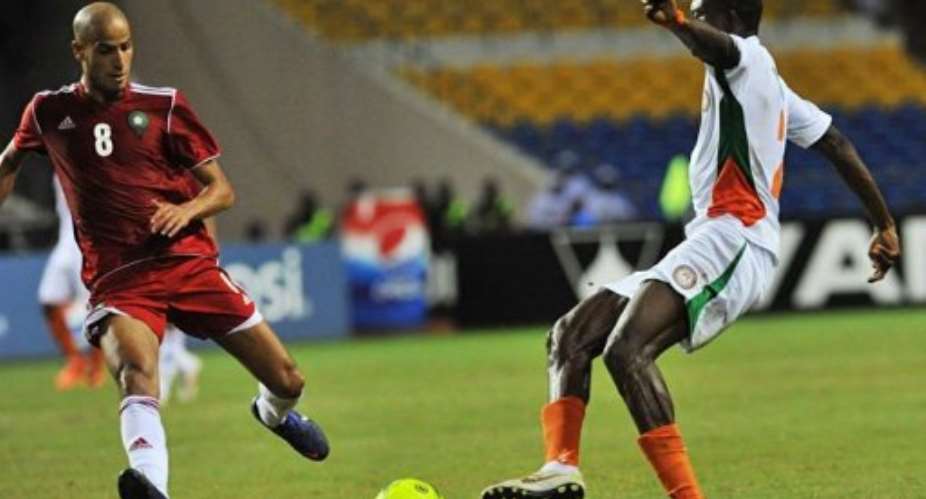 Morocco's El Ahmadi Karin L vies for the ball with Niger's Moussa Maazou.  By Issouf Sanogo AFP