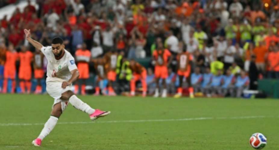 Moroccos Ismael Saibari scores the winning penalty in a 3-2 shootout defeat of the Netherlands.  By CARL DE SOUZA (AFP)