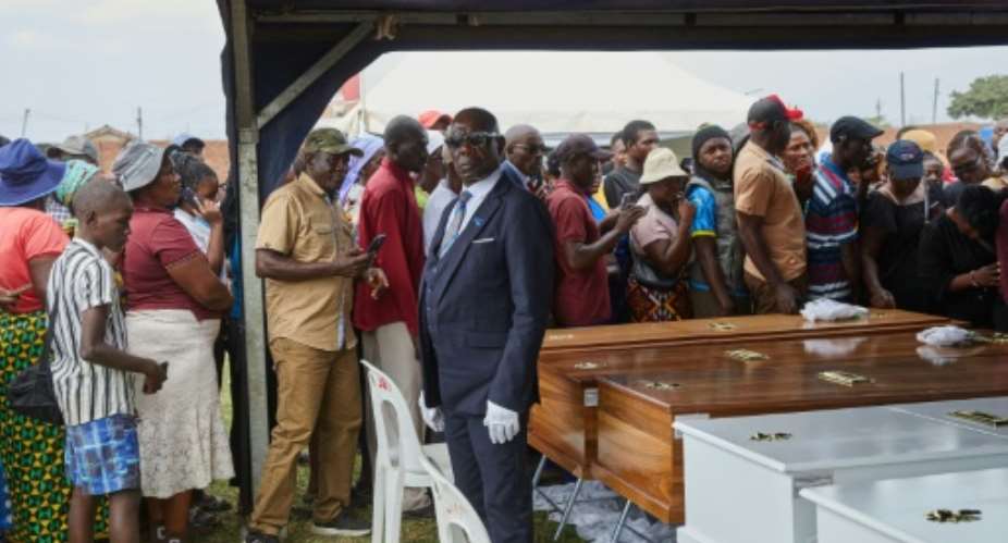 Most people on the overturned ferry were villagers and fish traders, with an unknown number of children also aboard.  By Jekesai NJIKIZANA (AFP)