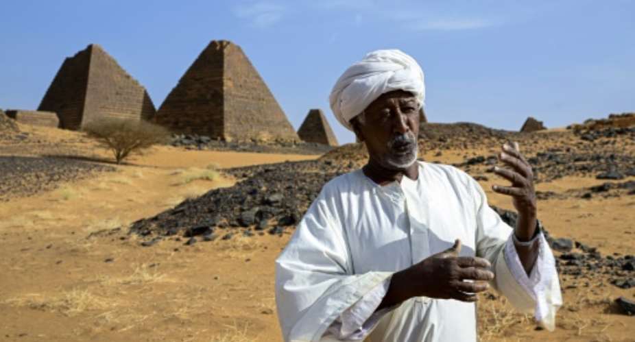 Mostafa Ahmed Mostafa is the heir to generations of groundskeepers in his family who have guarded Sudans pyramids of Meroe.  By KHALED DESOUKI (AFP)