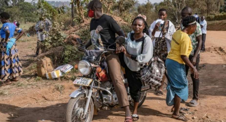 Mourners arrive for the burial procession of Ugandas King Oyo Nyimba Kabamba Iguru Rukidi IV, recognised as the worlds youngest reigning monarch.  By Badru KATUMBA (AFP)