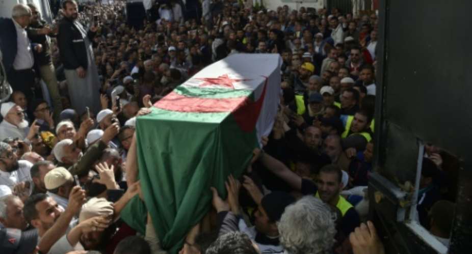 Mourners gathered for the funeral of Abassi Madani, founder of Algeria's Islamic Salvation Front.  By RYAD KRAMDI AFP