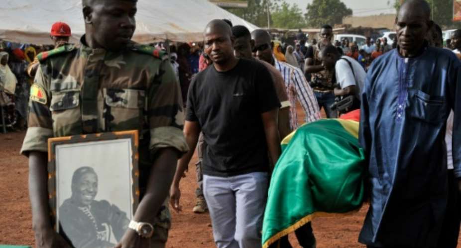 The send off for Malian photographer Malick Sidibe, whose coffin was draped in the national flag, took place in a working class neighbourhood of Bamako, with soldiers giving the iconic artist full honours.  By Habibou Kouyate AFP