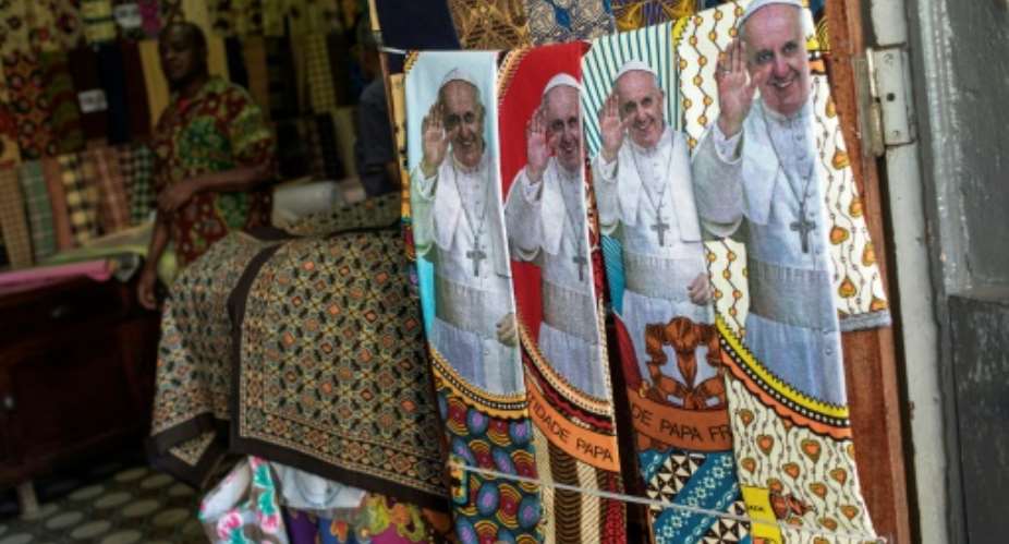 Mozambicans have been splurging on pope-related regalia.  By GIANLUIGI GUERCIA AFPFile