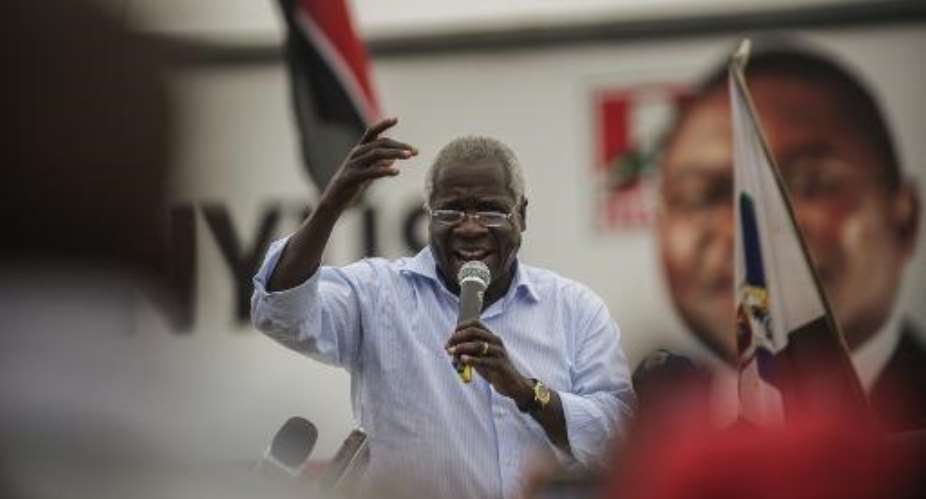 RENAMO presidential candidate Afonso Dhlakama C addresses a cheering crowd of supporters during a motorcade campaign rally on October 11, 2014 in Maputo.  By Gianluigi Guercia AFPFile