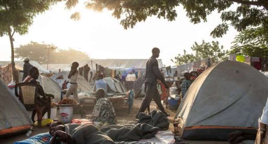South Sudanese internally displaced people pictured in Juba on February 19, 2014, in the Tongping UNMISS base, where over 27,000 people had sought refuge.  By Andrei Pungovschi AFP