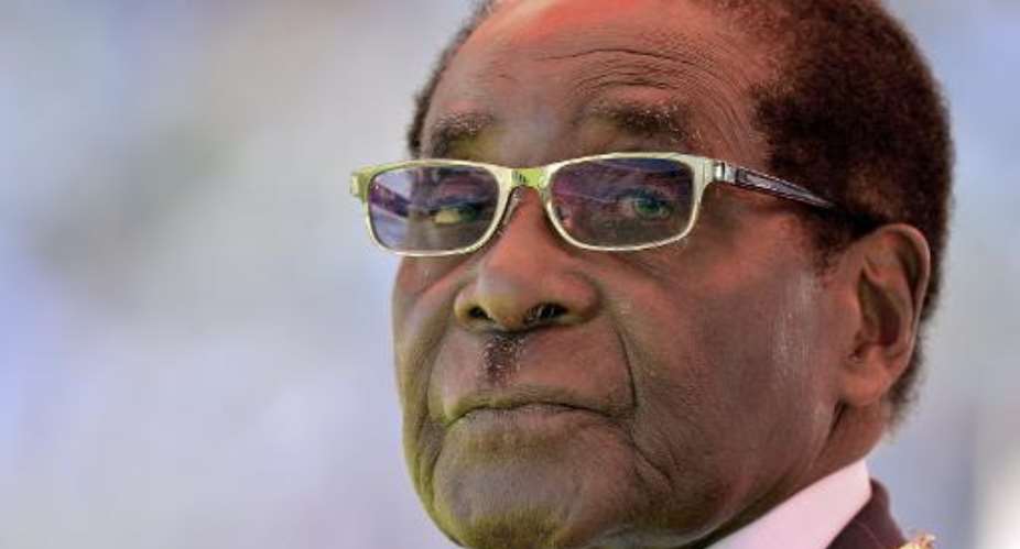Zimbabwean President Robert Mugabe attends his inauguration and swearing-in ceremony at the sports stadium in Harare on August 22, 2013.  By Alexander Joe AFPFile