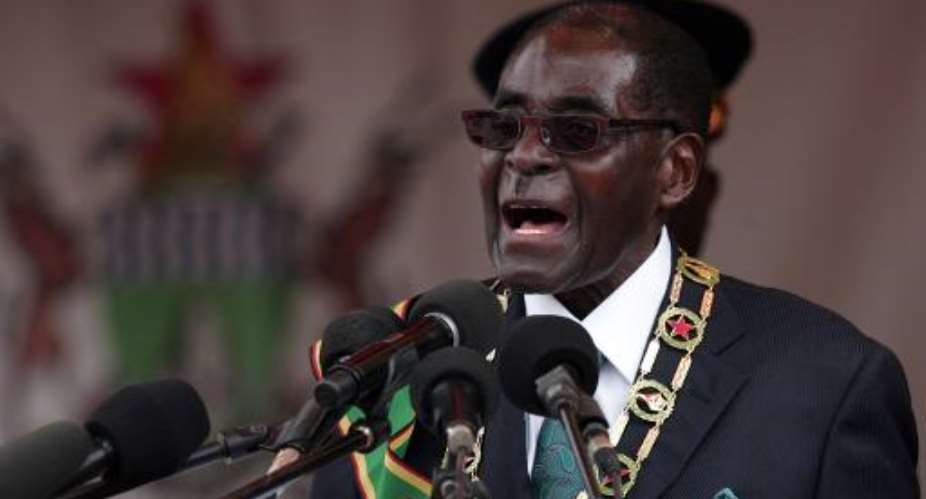 Zimbabwe President Robert Mugabe gives an address during celebrations for the country's 34th independence anniversary on April 18, 2014 in Harare.  By Jekesai Njikizana AFPFile