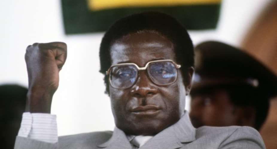 Mugabe, pictured in July 1984 at the height of his 37 years in power.  By ALEXANDER JOE AFP